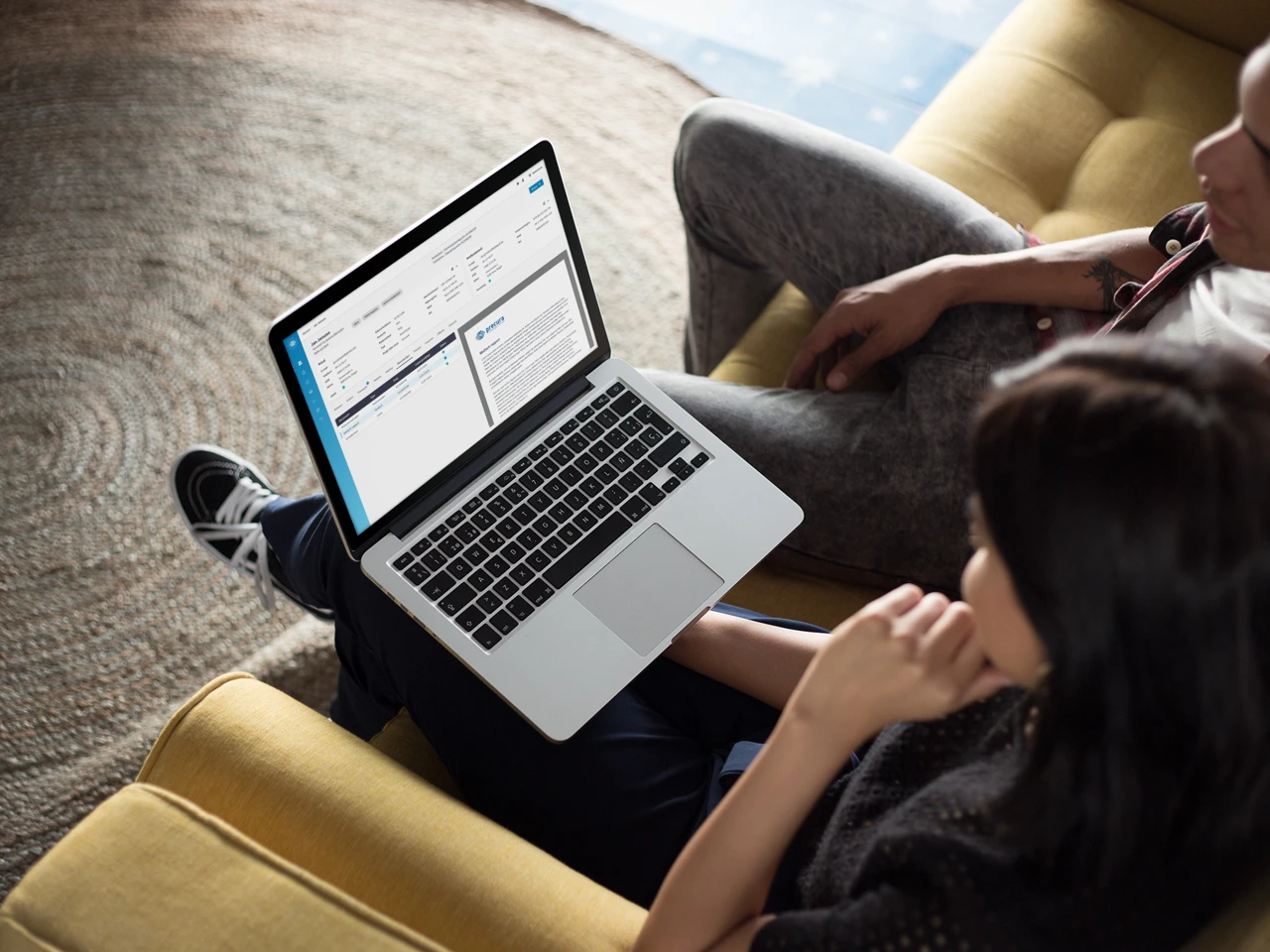 coworkers-working-on-a-macbook-mockup-while-talking-about-it-a20769.png